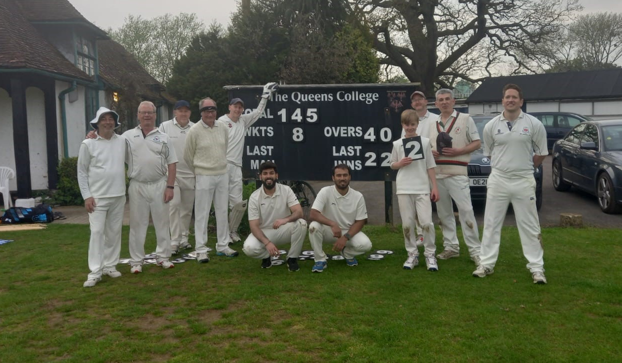 Team photo around final scoreboard after Isis CC victory over Wytham in 2023